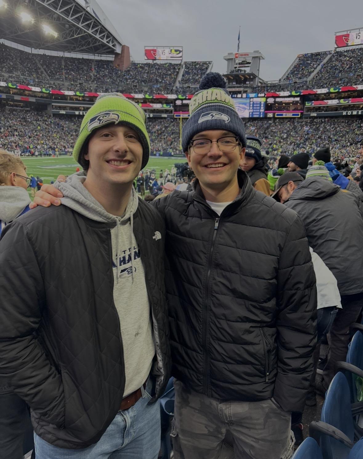Rohan with a friend at a Seattle Seahawks game at Lumen Field