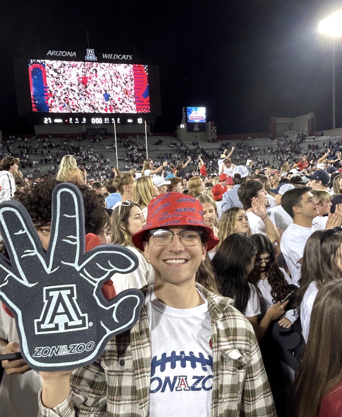 Rohan at a University of Arizona night football game in Wildcats gear