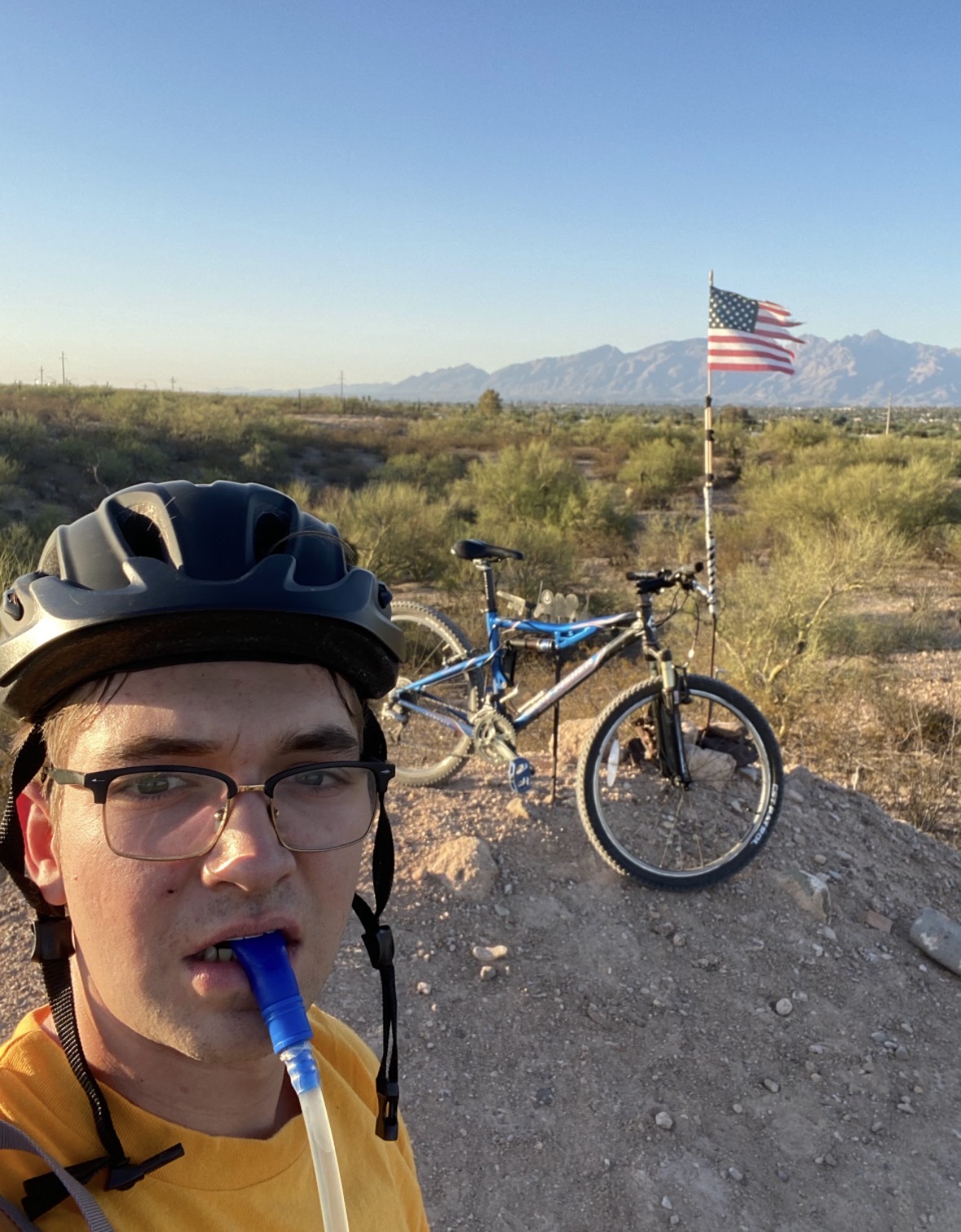 Rohan in a helmet on a mountain bike ride in desert hills